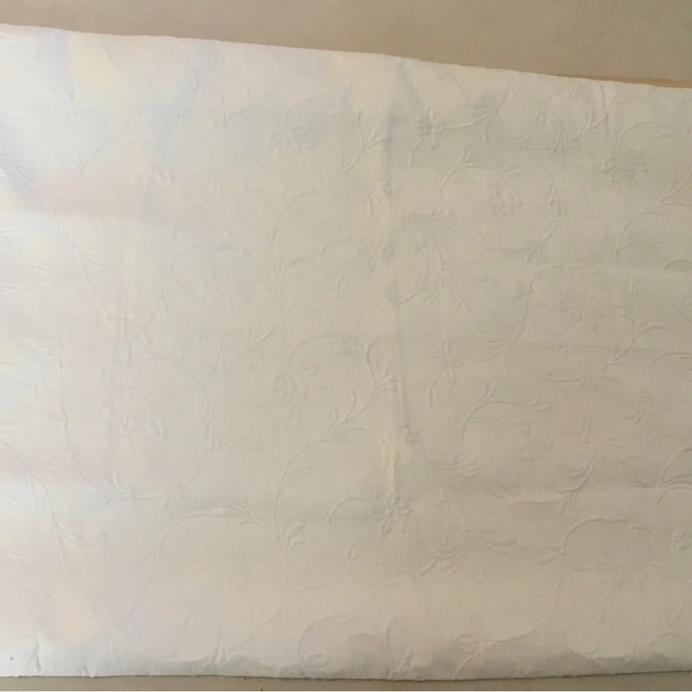 Headboard slipcover. Matelasse fabric in ecru.
